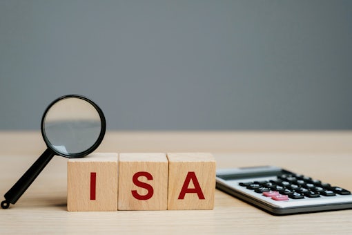 ISA – Individual Savings Account on a wooden blocks. Class of retail investment arrangement available to residents of the United Kingdom. Business and finance concept