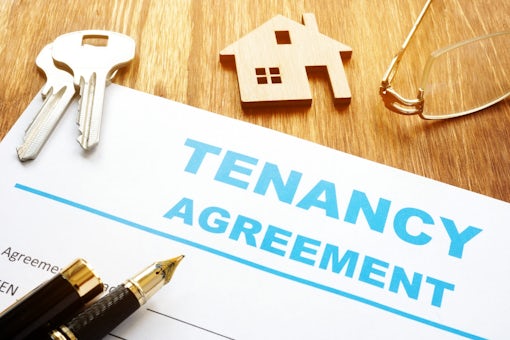 Tenancy agreement for rental lease and keys.