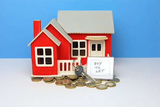Buy To Let Key Ring And Key Outside A Scale Model Home