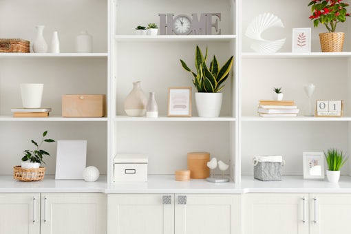 Shelf unit with beautiful decor in room
