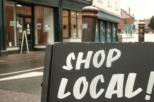 A shop local sign on a chalk board in Norwich, UK