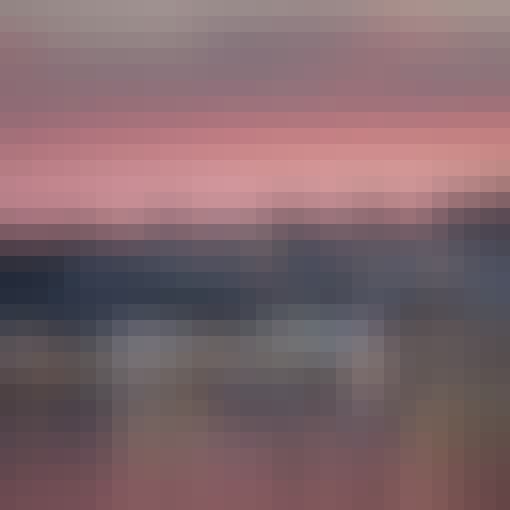 Cardiff Bay, looking towards Penarth, south Wales, during a beautiful, red sunset. The lights are reflecting on the calm water