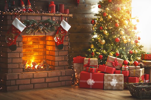 interior christmas. magic glowing tree, fireplace, gifts