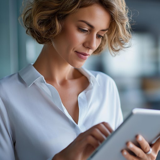 Faceless portrait of woman working on tablet computer in modern office, make account analysis report, real estate investment information financial and tax system concepts, defocused