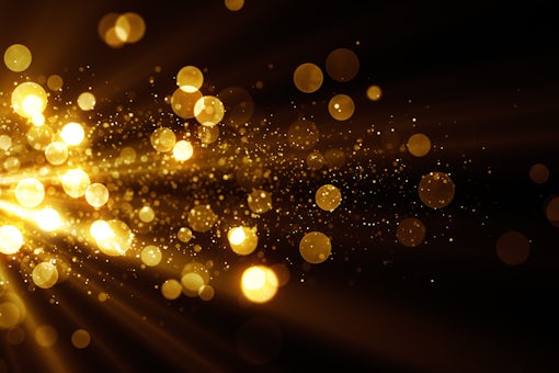 Glitter celebration texture. Golden stream with particles. Abstr