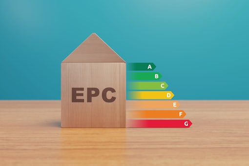 EPC House energy performance certificate - Little cute house made of wooden blocks for property energy rating from A to F