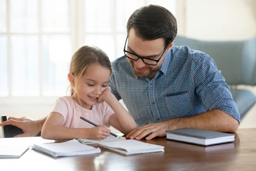 Father and daughter doing homework