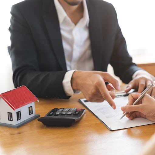 Asian landlord calculate price, client or tenant hand sign contract rental purchase buyer home with landlord, realtor after banker agreement mortgage, loan success done. Property lease agent concept.