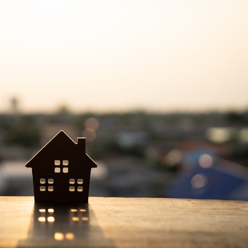 House model on wood table. Real estate agent offer house, property insurance and security, affordable housing concepts