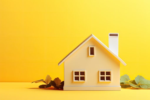 A minimalistic design is presented with a small white toy house, placed on a vibrant yellow background. symbolizes a dream home, mortgage property insurance, and a banner with copy space is displayed
