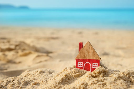little red house on sand beach, tropical natural background. Hom