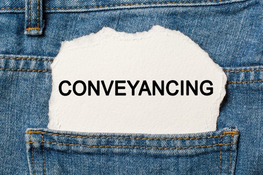Conveyancing, written on torn paper.