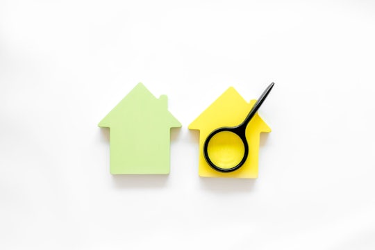 Search for a new house concept with house figure and magnifier.