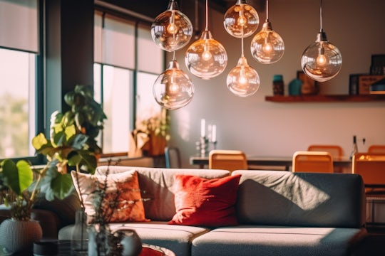 Pendant lights above a sofa in a cozy living room.