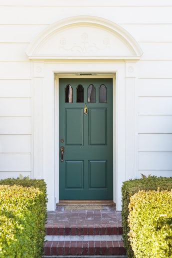 Narrow front green door