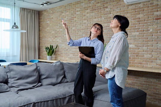 Female real estate agent showing apartment, house, to buyer, tenant
